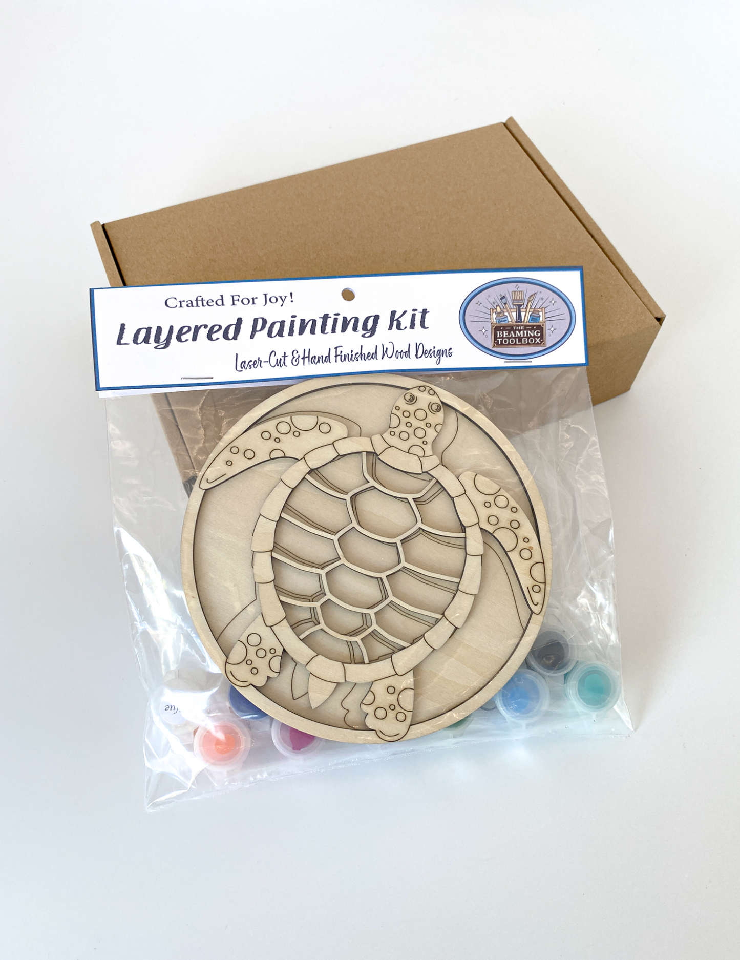 Layered painting kit with turtle design and packaging on a white background