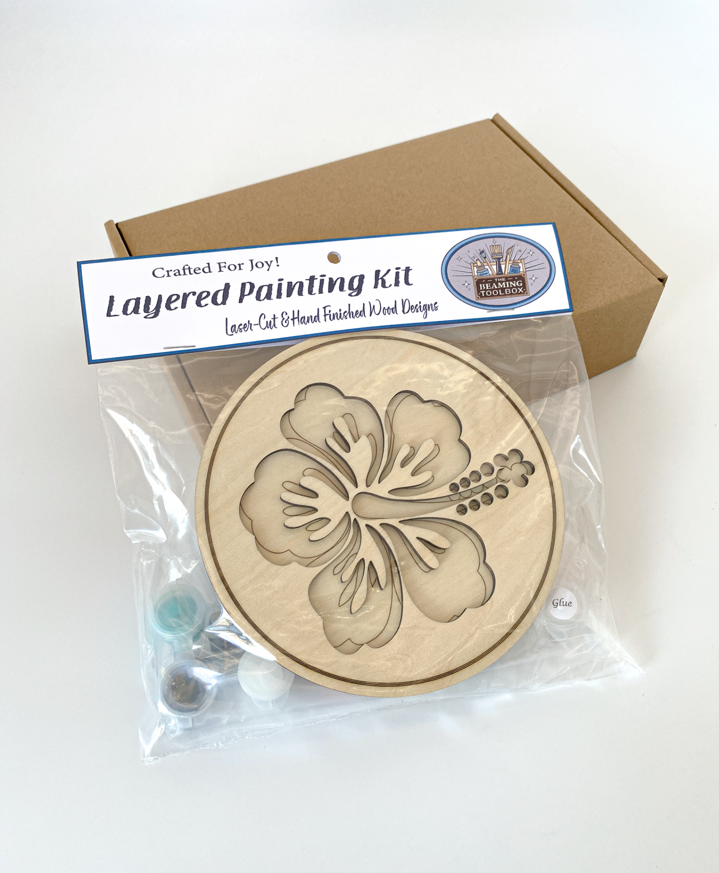 Layered painting kit with a wooden blank featuring a Hawaiian Hibiscus Flower branded 'Crafted For Joy'.
