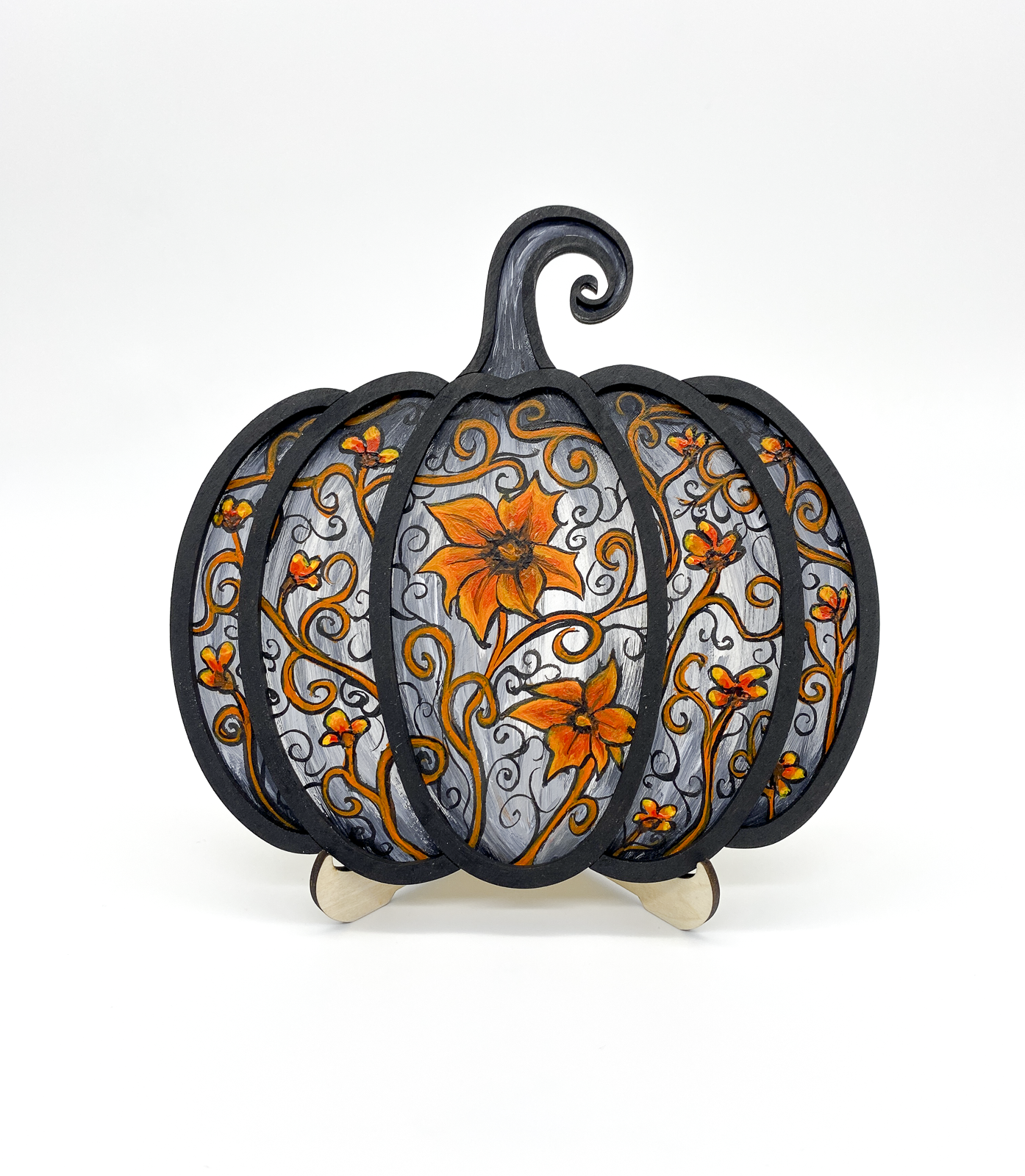 Decorative pumpkin with floral patterns on a white background