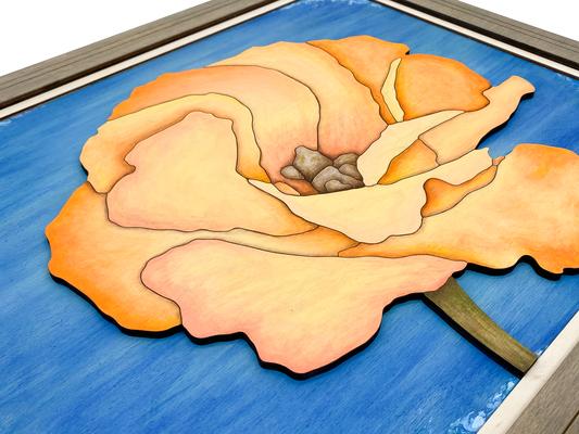 Low-angle close-up of "Apricot Bloom" sculptural wood art, showing the physical 3D layers and the shadow play between the laser-cut birch petals.