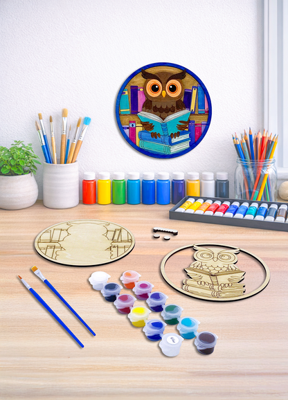 A 3D layered owl wood kit designed for book lovers, shown with painting tools and a finished piece in a cozy room setting.