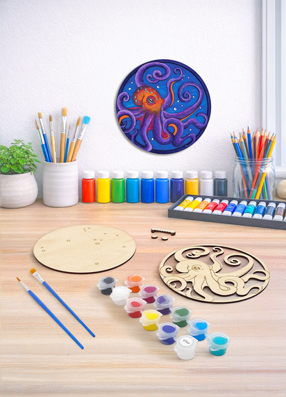 A 3D octopus wood art kit showing the unpainted layers, paint set, and hardware needed to create ocean decor.