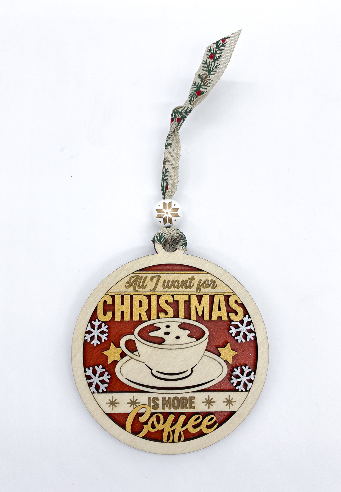 Decorative Christmas ornament with a coffee cup design and text on a white background