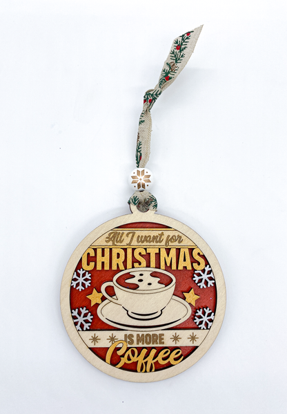 Decorative Christmas ornament with a coffee cup design and text on a white background