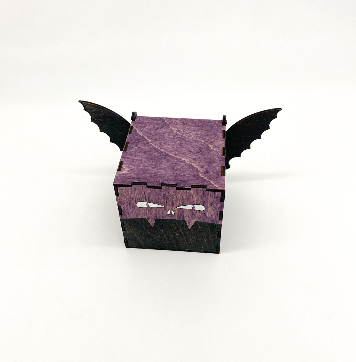 Purple and black bat-shaped box on a white background