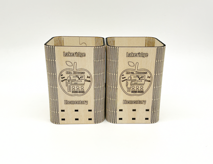 Personalized Teacher Pencil Holder On A Desk, Holding Pens And Pencils, With Custom Engraved Name, School, And Year Visible.