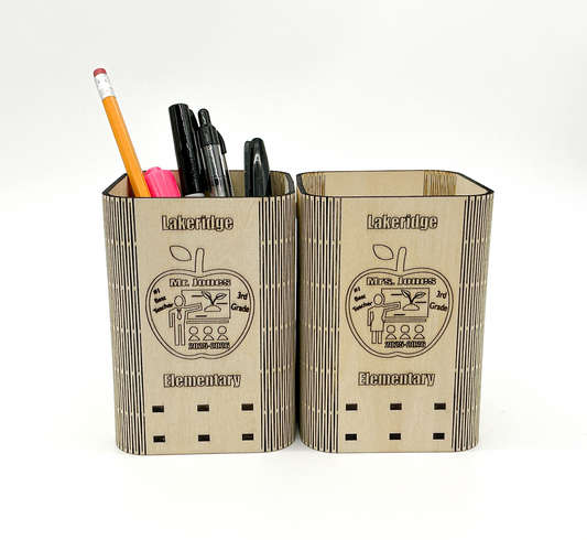 Personalized Wooden Teacher Pencil Holder On A Desk, Holding Pens And Pencils, With Custom Engraved Name, School, And Year Visible.