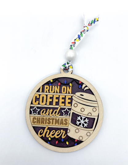 Decorative ornament with 'I run on coffee and Christmas cheer' text and a coffee cup design.