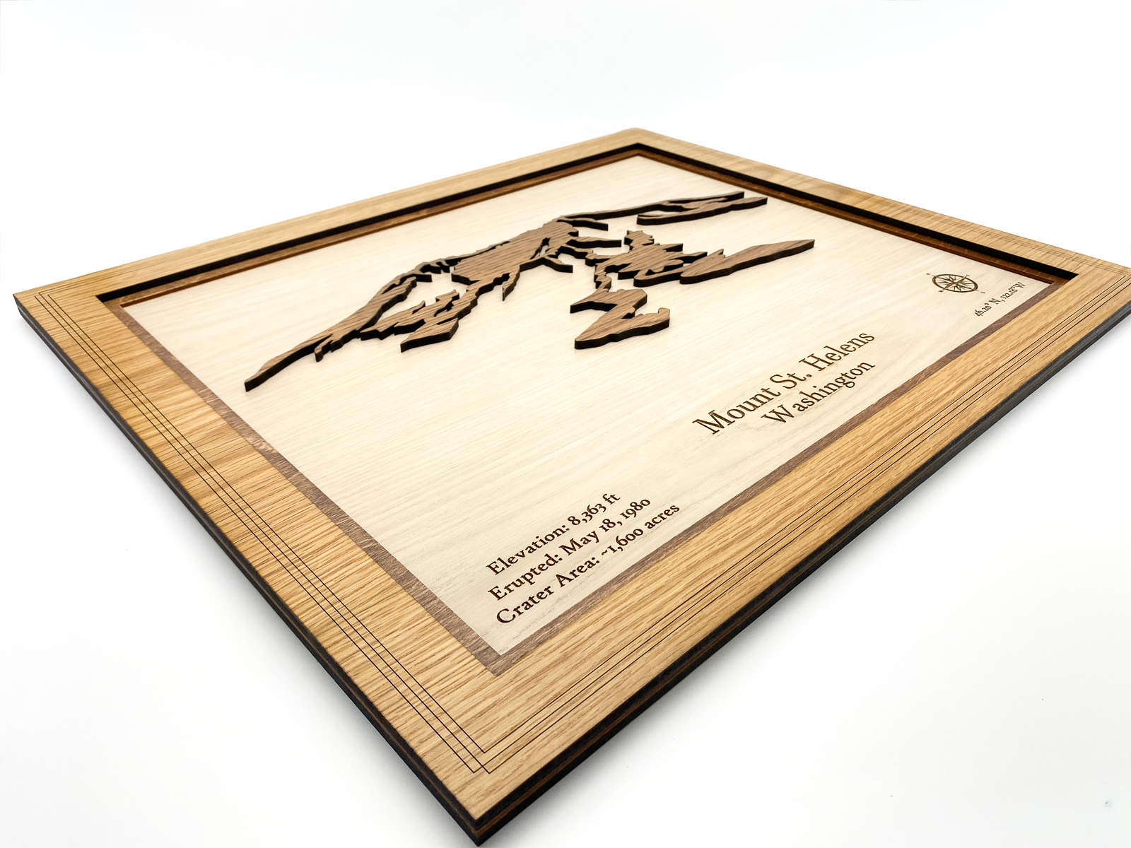 Close-up side view showing the three distinct layers of white oak and walnut wood and the 3D depth of the mountain
