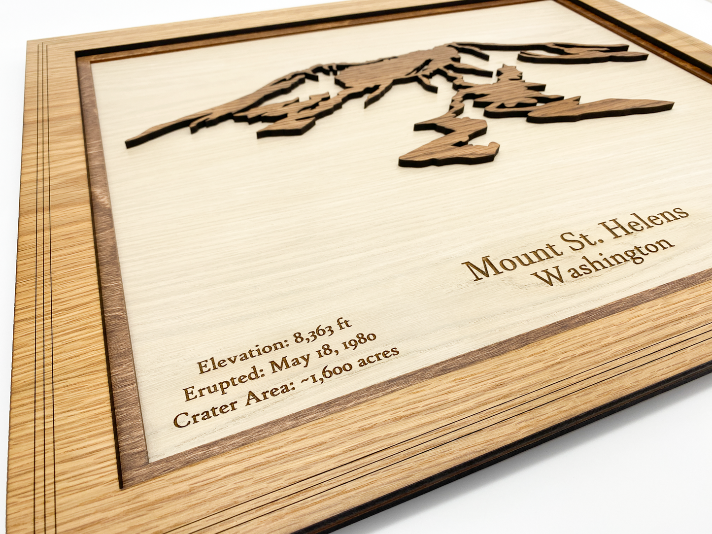 Close-up of the engraved topography details on a 19x23 inch wood map of Mount St. Helens.