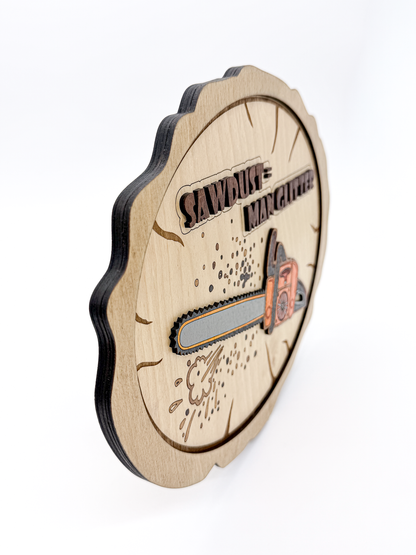 Angled side view of layered laser-cut wood wall art with a chainsaw design and “Sawdust = Man Glitter” text, showing the dimensional wood layers.