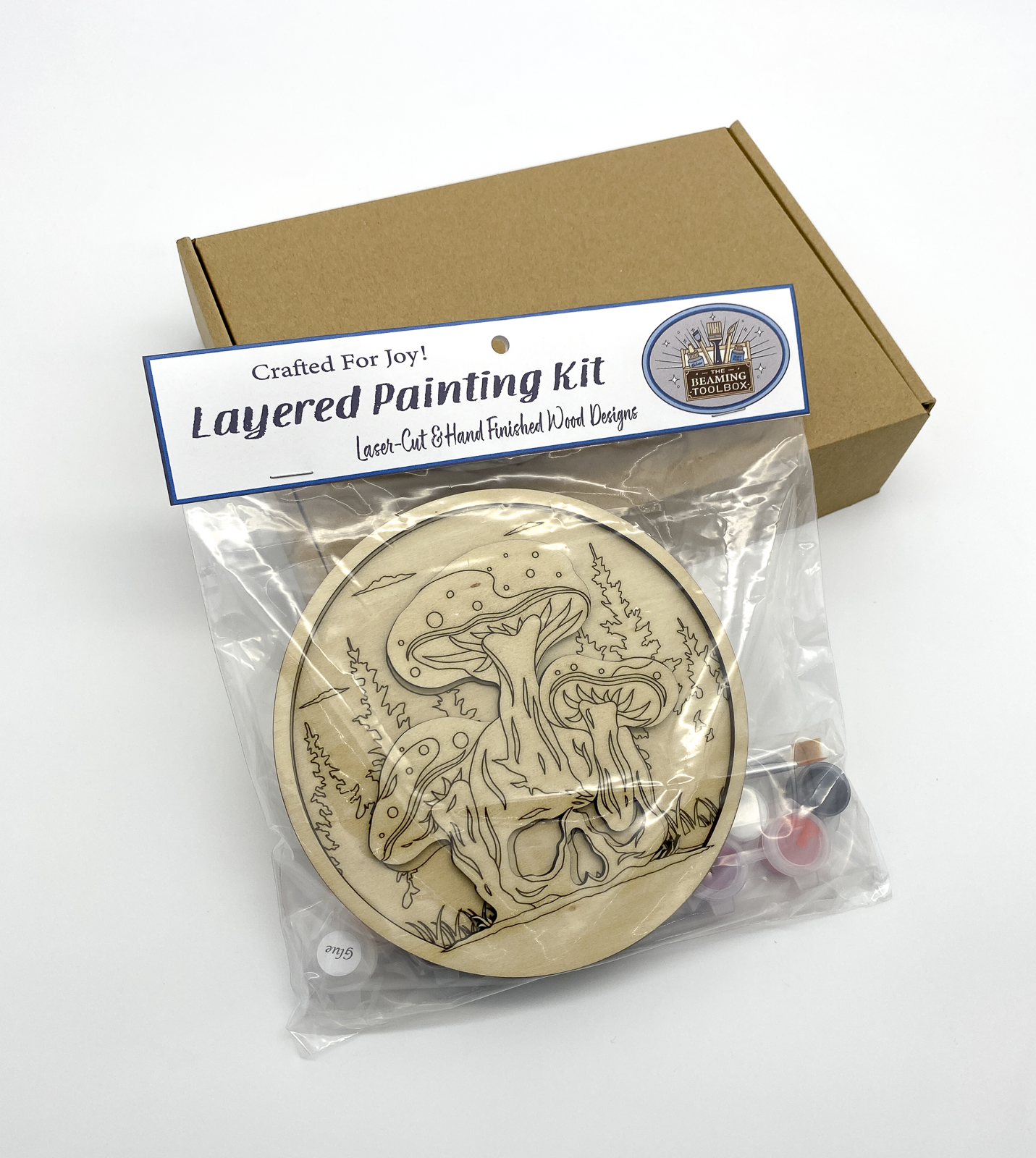 Layered painting kit with packaging on a white background