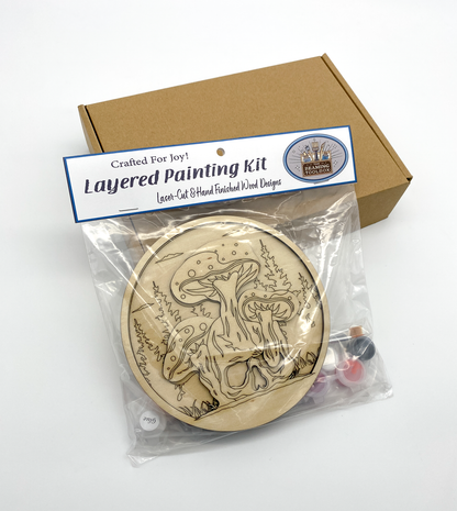 Layered painting kit with packaging on a white background