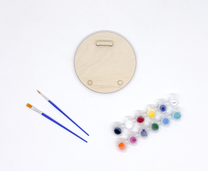 The Back Of A DIY Paint Kit Featuring With Sawooth Hanger And Bumpers.