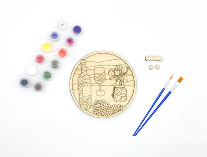 Unpainted 2-layer wood craft kit for adults featuring a wine bottle and vineyard scene with included acrylic paints and brushes