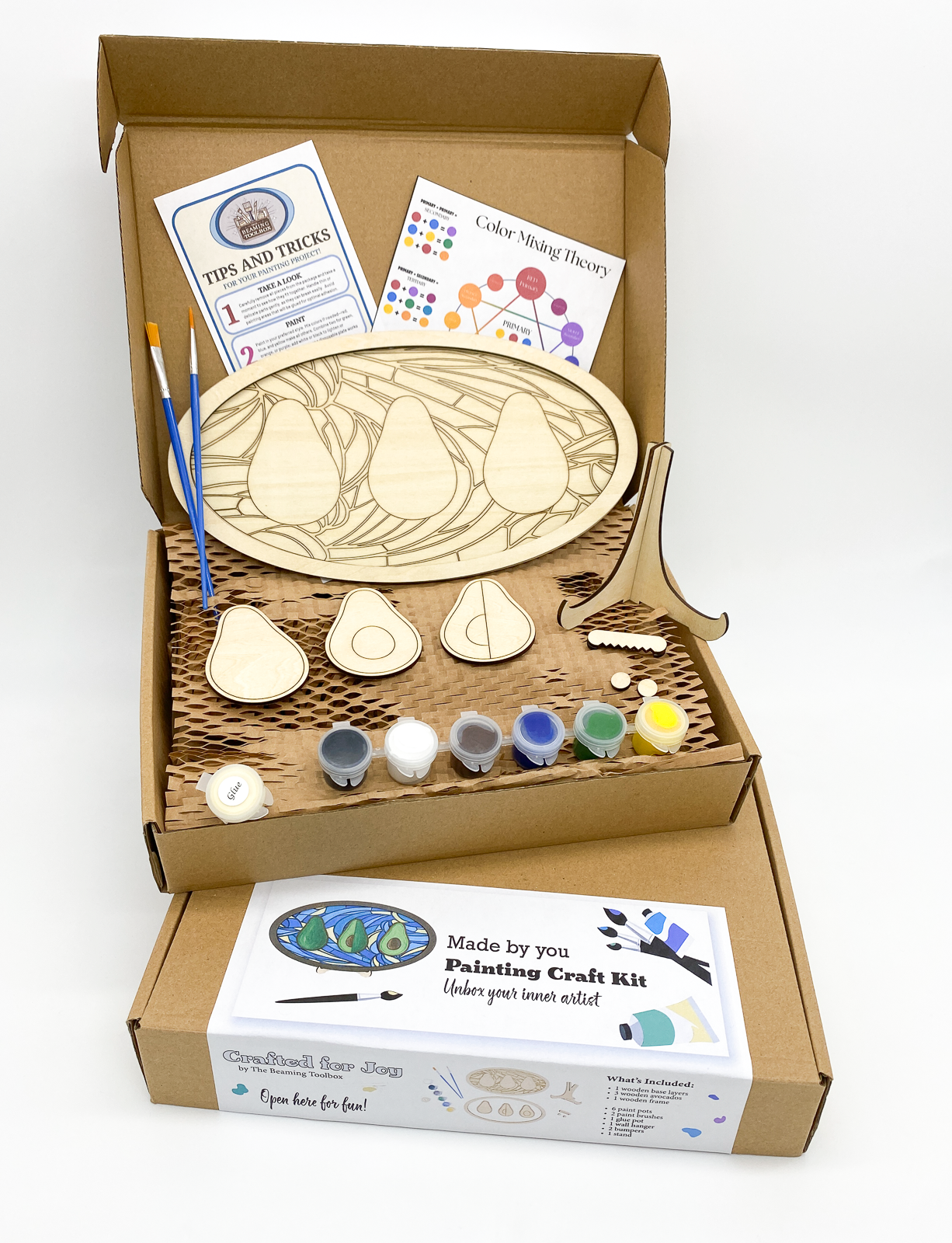 Boxed Avocado Fun DIY paint kit packaging showing layered wood avocado design and all included kit contents such as paint pots and brushes