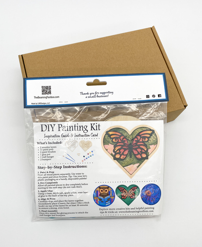 Back of Butterfly Heart DIY paint kit packaging with insert displaying finished painted butterfly heart example and kit contents information