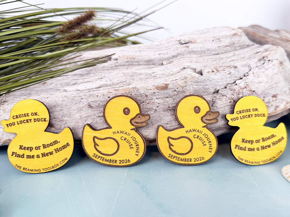 Four personalized wooden cruise duck tokens showing custom cruise details on the front and hiding messages on the back.