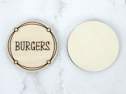Front and back of a wooden Dinner Decision Coin showing an engraved burgers design and smooth unfinished reverse side.