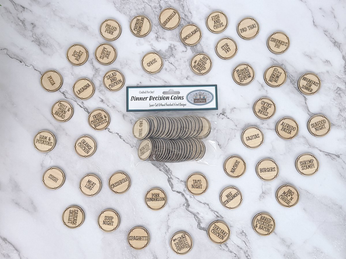 Wooden Dinner Decision Coins arranged around the packaged set, each engraved with a different meal idea.
