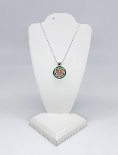 Silver snake chain necklace with wooden paw print pendant displayed on neutral background for dog lovers