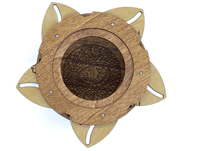 Interior of dragon keepsake box revealing an engraved dragon eye beneath the iris opening.