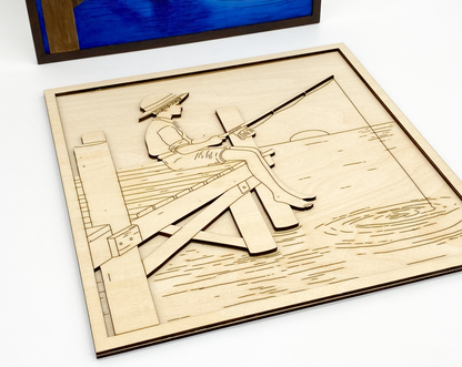 Close-up of painted fishing boy kit showing layered wood details