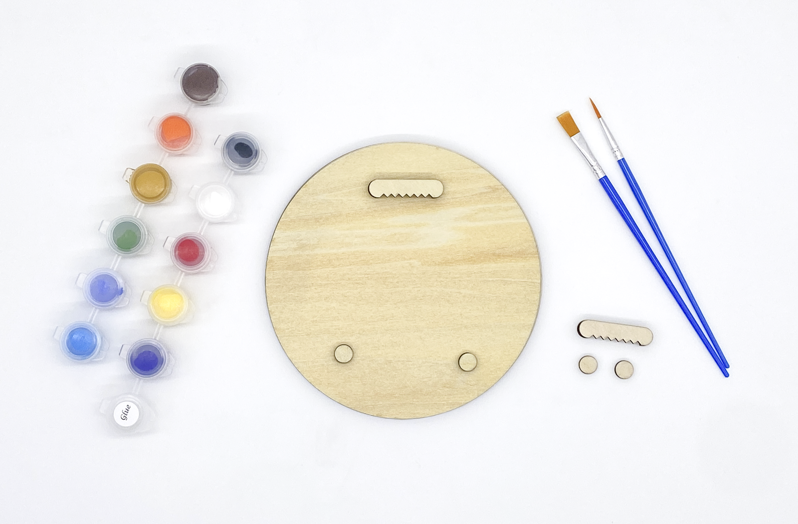 Back of fox wood art showing sawtooth hanger and bumpers installed with paint pots and brushes