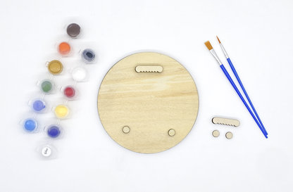 Back of fox wood art showing sawtooth hanger and bumpers installed with paint pots and brushes