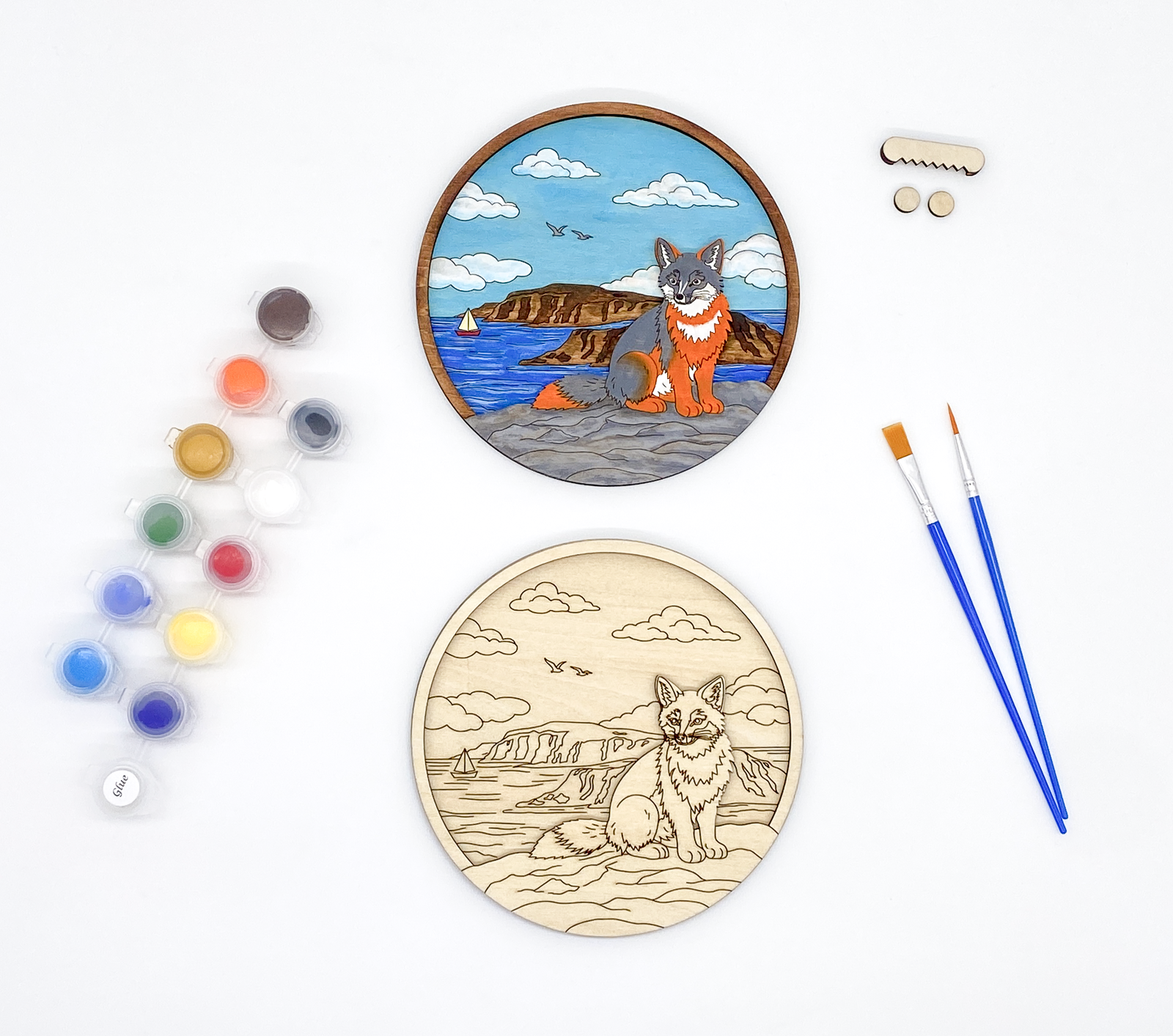 Fox DIY paint kit packaged in clear bag with label showing wood layers, paint pots and brushes