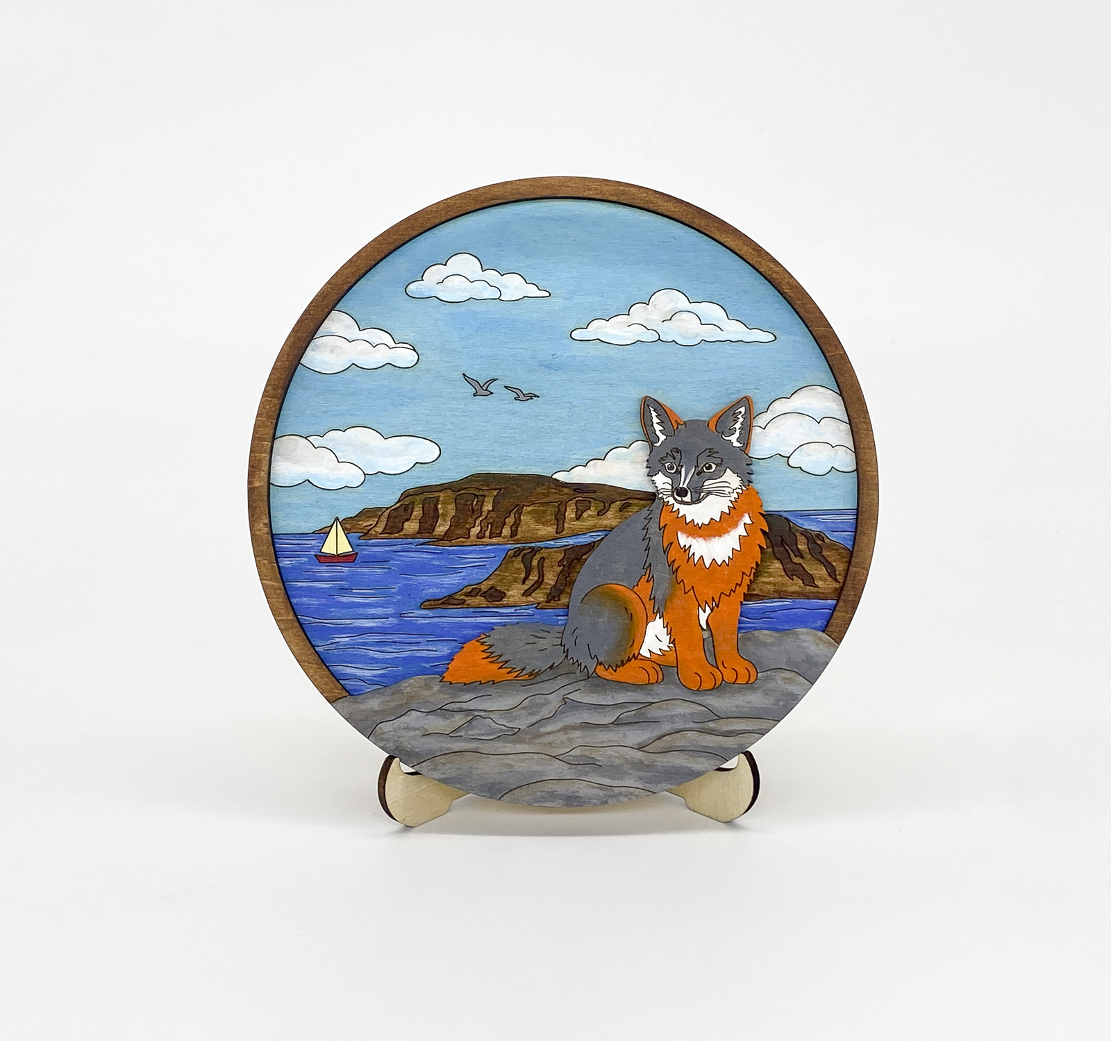 Finished fox coastal layered wood paint kit on white background showing fox overlooking ocean scene