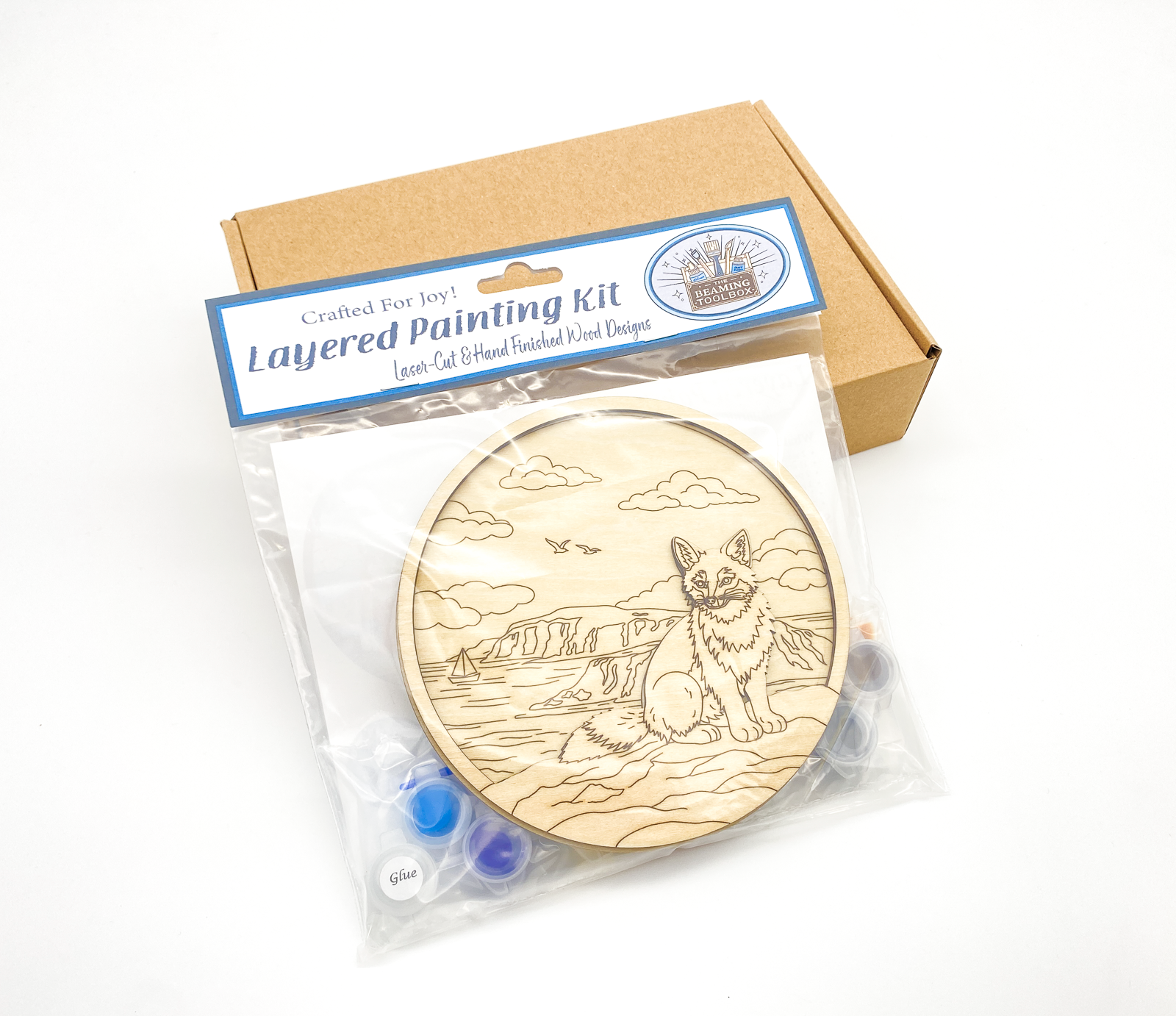 Fox DIY paint kit packaged in clear bag with label showing wood layers, paint pots and brushes