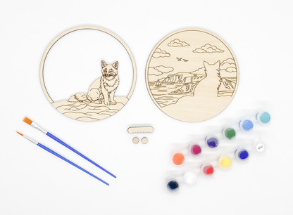 Fox DIY paint kit with unpainted layers laid flat alongside paints, brushes and hanger hardware