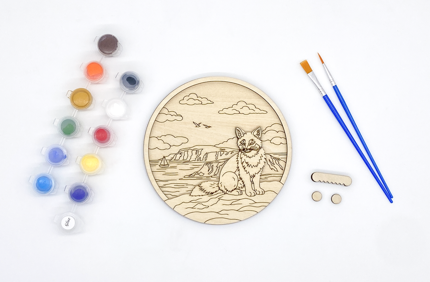 Unpainted fox layered wood paint kit with stacked basswood pieces, paint pots, brushes and hardware