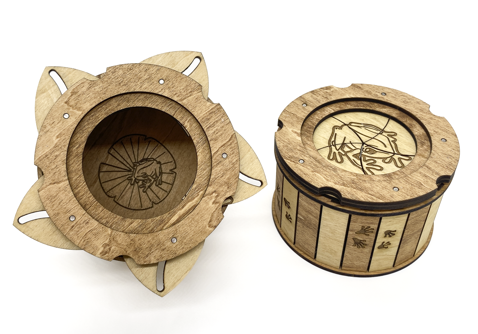 Close-up comparison of the Frog Keepsake Box opened and closed, highlighting the iris mechanism and engraved frog artwork.