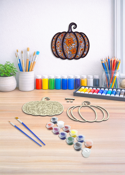 Gothic pumpkin DIY paint kit styled in fall decor setting with craft supplies and finished piece displayed