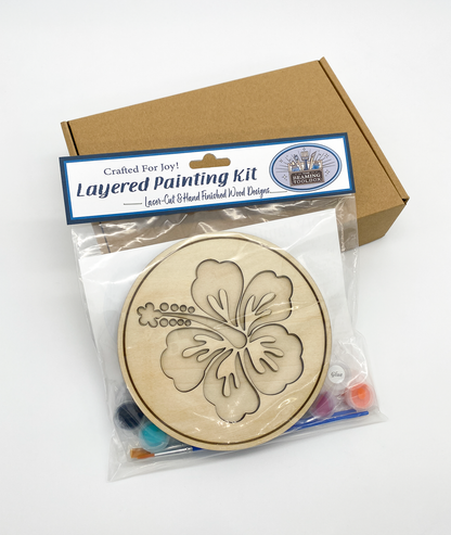 Front of Hawaiian Hibiscus DIY paint kit packaging showing layered wood hibiscus flower design and included painting supplies