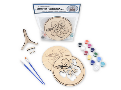 Packaged Hawaiian Hibiscus layered painting kit with unfinished wood pieces, paint pots, brushes, glue, display stand, and hardware.