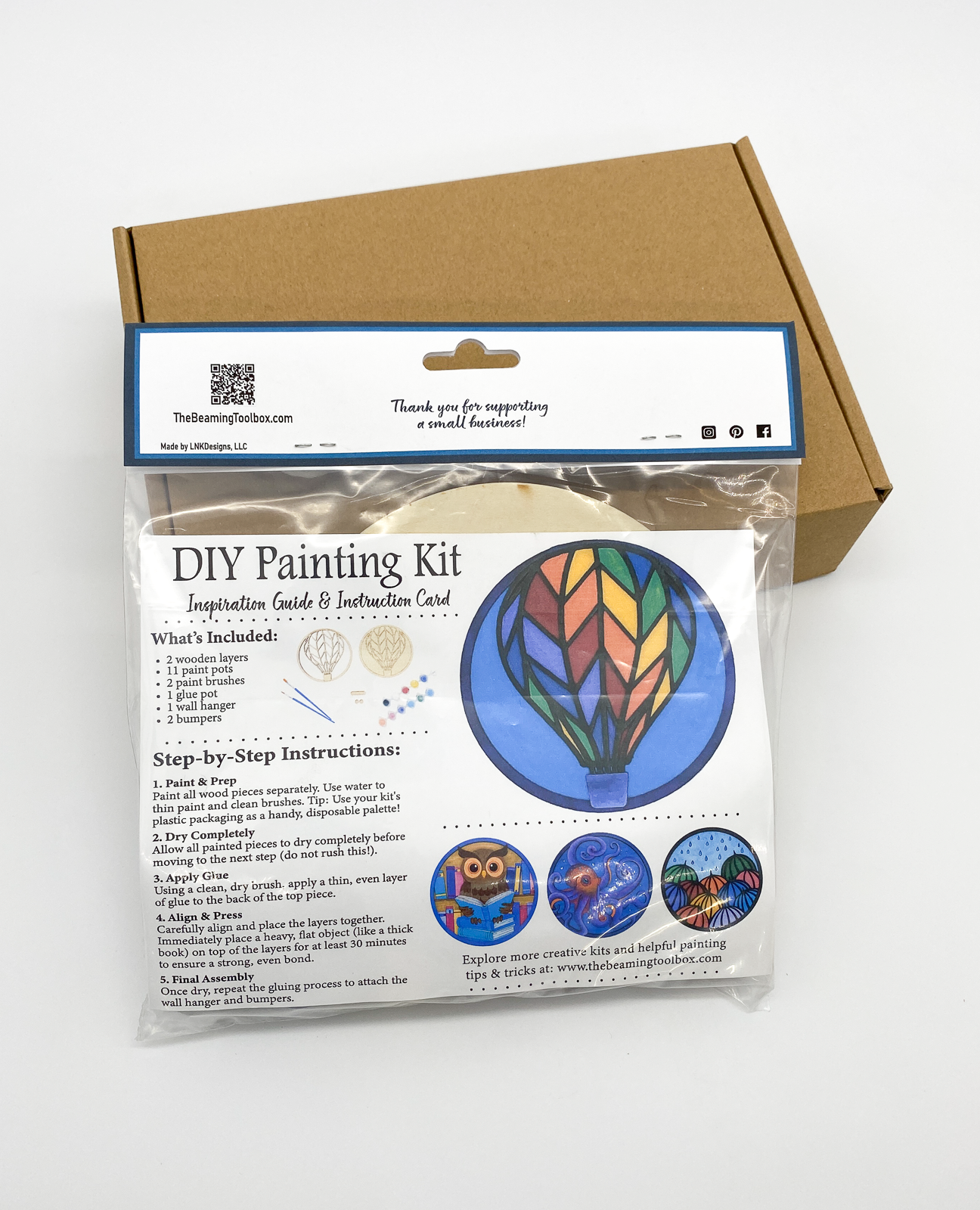 Back of Hot Air Balloon DIY paint kit packaging with insert displaying finished painted hot air balloon example and kit contents information