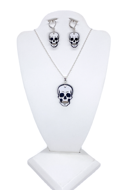 Layered wood skull necklace and matching earrings displayed on a white jewelry bust.
