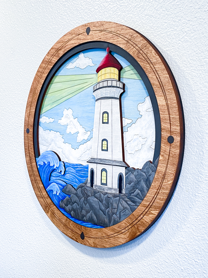 Decorative wall art of a lighthouse with a wooden frame on a light background