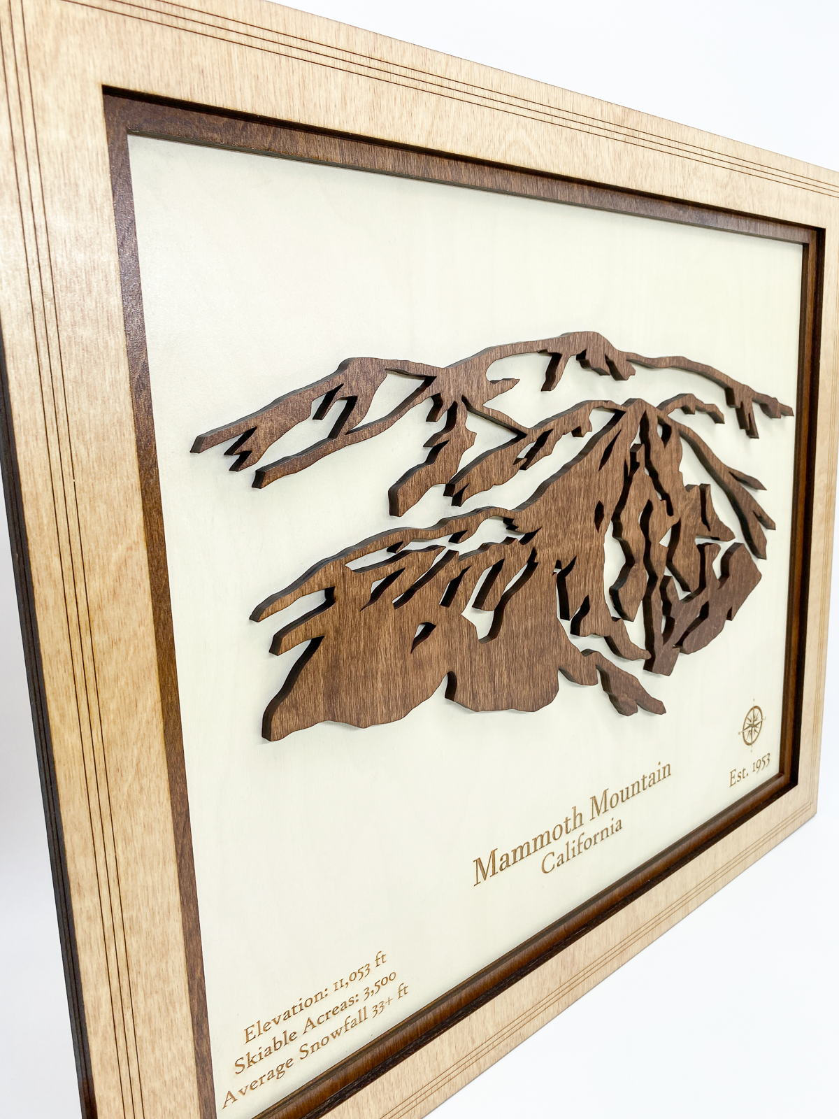 Angled view of Mammoth Mountain layered wood relief art highlighting depth and frame detail