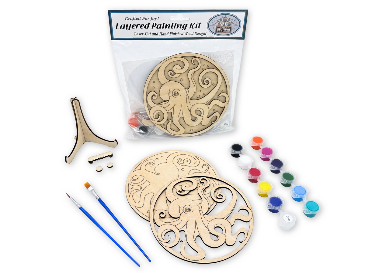Complete octopus adult painting kit with layered wood pieces, paint pots, brushes, glue, display stand, hardware, and packaged guide.
