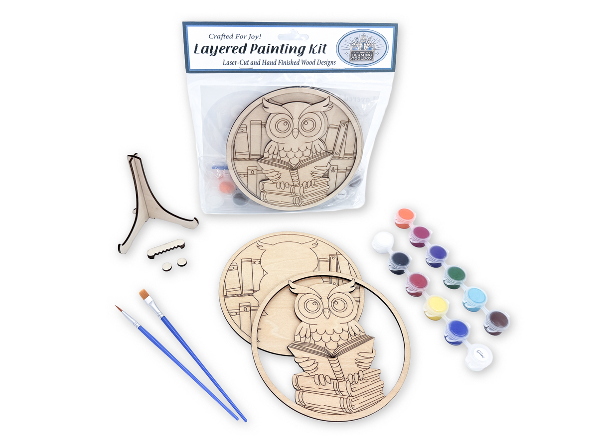 Book lovers owl layered painting kit sealed in packaging with the unfinished wood design visible through the clear bag.