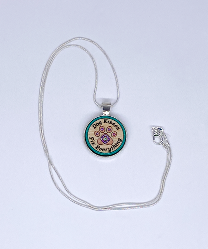 Wooden paw print pendant with heart accents on a silver-plated snake chain, handcrafted jewelry for pet lovers