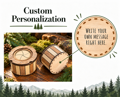 Two cylindrical wooden boxes with alternating light and dark wood vertical slats. One box features a circular aperture lid with curved segments. The other box shows a flat circular top with the text WRITE YOUR OWN MESSAGE RIGHT HERE.