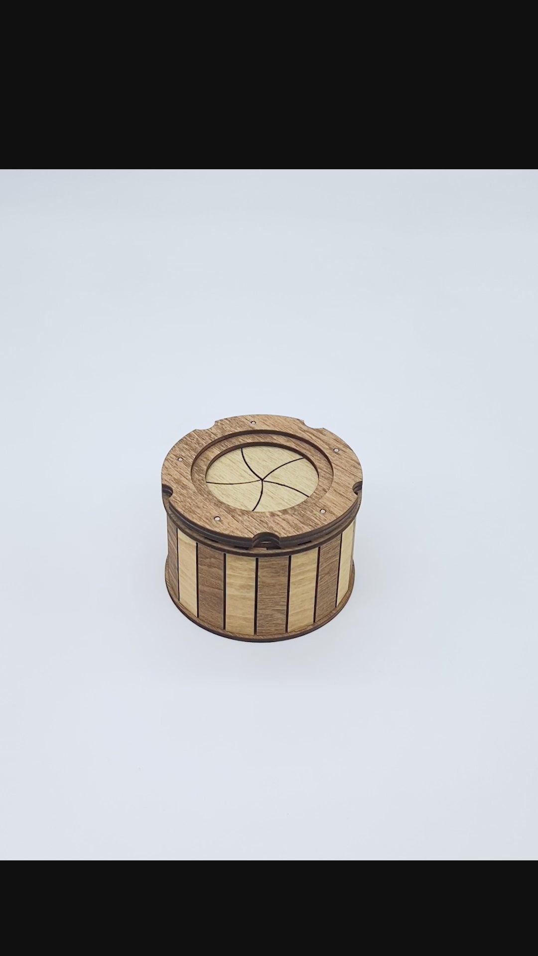 Watch the handcrafted wooden keepsake box smoothly open with its unique twist-open iris mechanism, revealing a hidden storage compartment perfect for jewelry, dice, crystals, coins, and other small keepsakes.