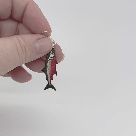 Video showing three styles of hand-painted wooden salmon earrings with green backs and silver plated hooks