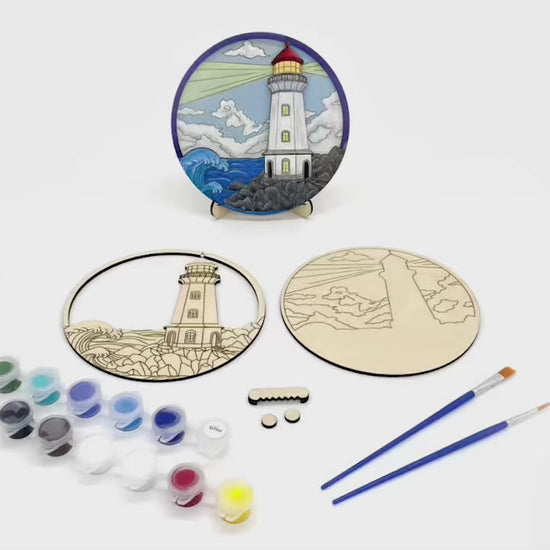Time-lapse video of painting and assembling a layered wood lighthouse DIY paint kit and displaying the finished coastal art piece