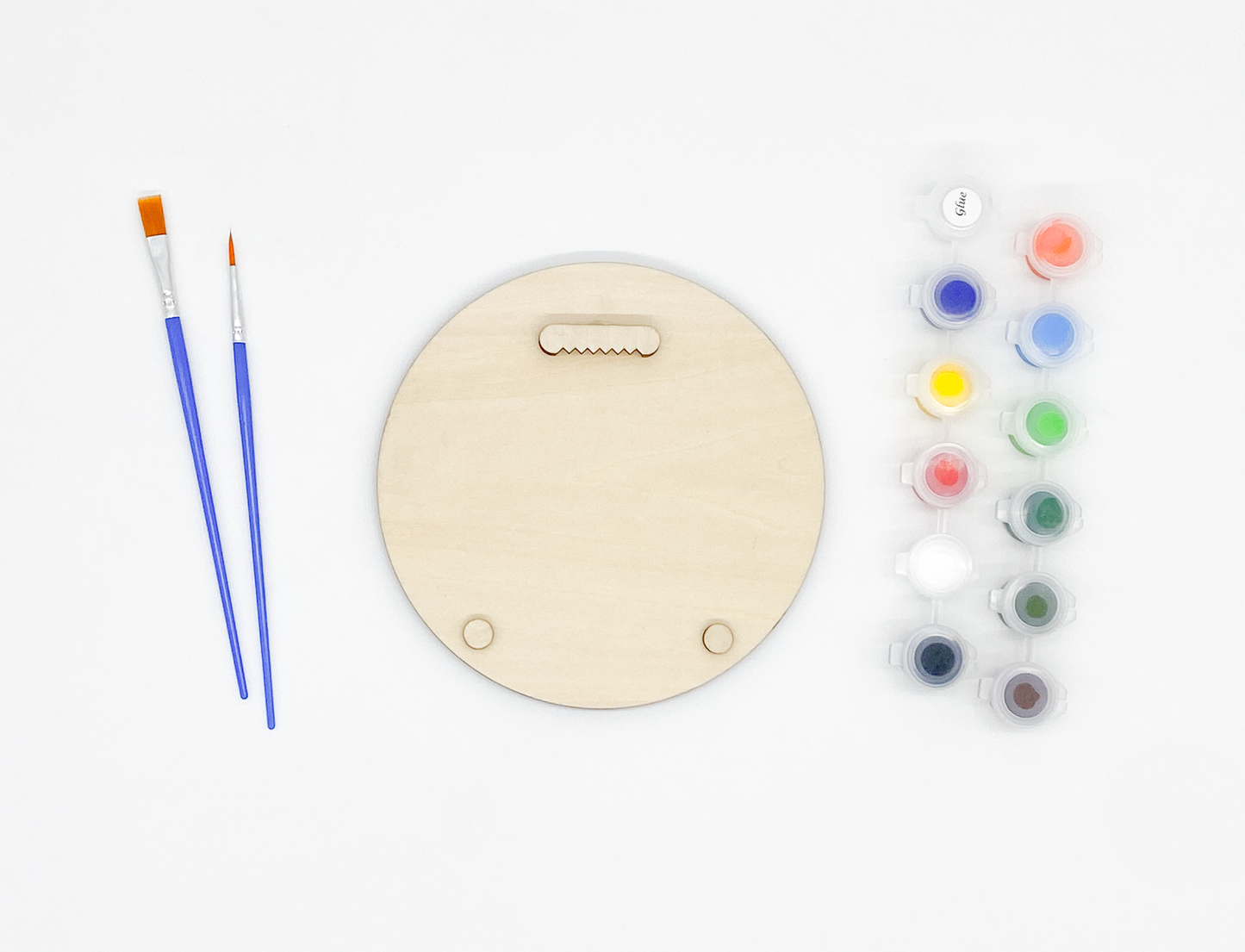 The back of the Sasquatch wood kit showing the included sawtooth hanger, wooden bumpers, paint pots, and brushes